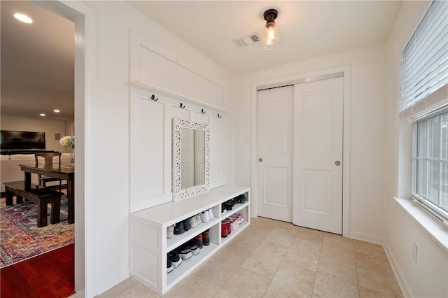 mudroom featuring recessed lighting and baseboards