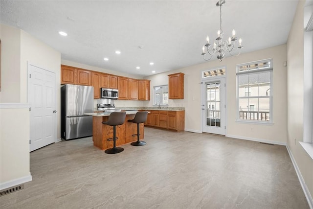 3009 Village Run, Pine Twp Nal, PA 15090 - kitchen with stainless steel appliances, a chandelier, a center island, a breakfast bar, and recessed lighting