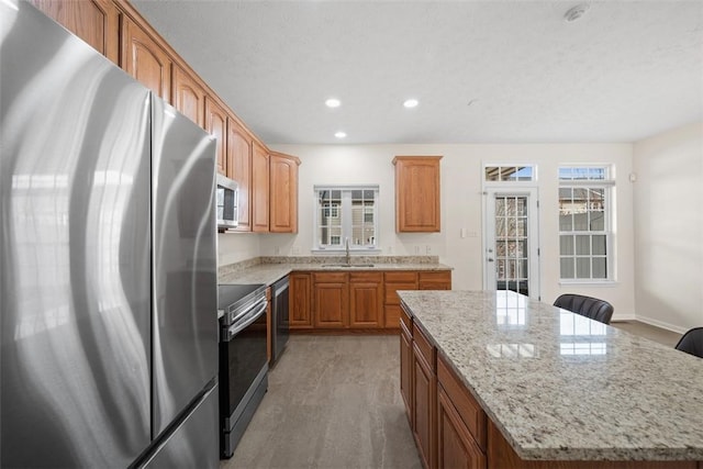 3009 Village Run, Pine Twp Nal, PA 15090 - kitchen featuring stainless steel appliances, a sink, a kitchen island, light stone counters, and recessed lighting