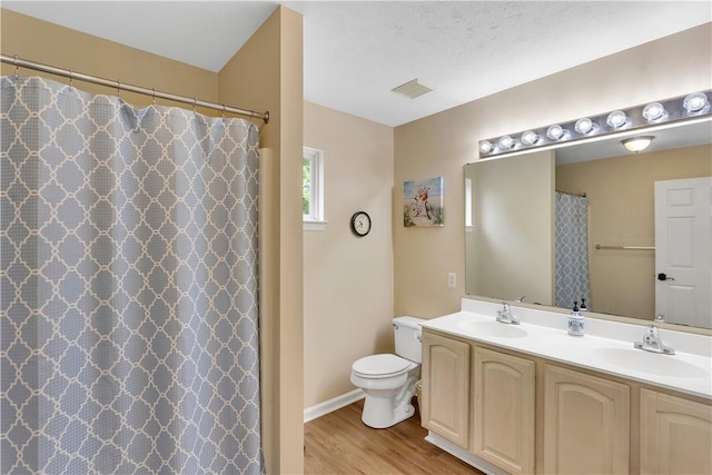 full bath featuring wood finished floors, toilet, double vanity, baseboards, and a shower with shower curtain