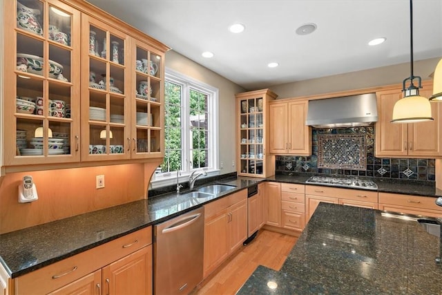 305 Woodstream Dr, Ohara, PA 15238 - kitchen featuring wall chimney exhaust hood, appliances with stainless steel finishes, a sink, light wood-style flooring, and dark stone counters