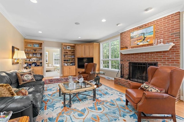305 Woodstream Dr, Ohara, PA 15238 - living room featuring ornamental molding, light wood finished floors, recessed lighting, and a brick fireplace