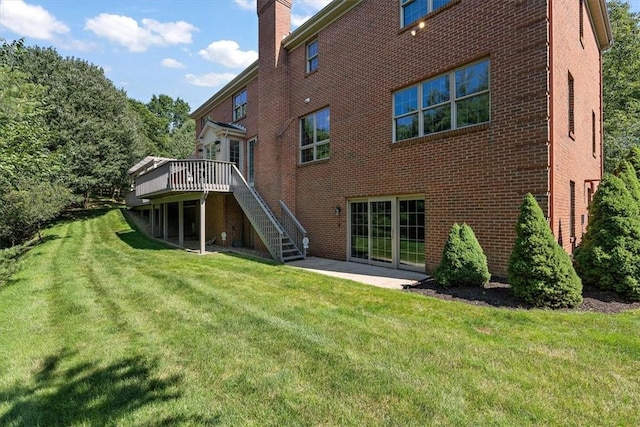 305 Woodstream Dr, Ohara, PA 15238 - back of property featuring brick siding, a chimney, stairs, a yard, and a wooden deck