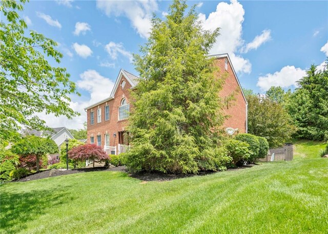432 Independence Blvd, South Strabane, PA 15301 - view of home's exterior featuring brick siding and a yard