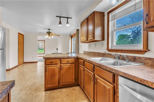 1636 Brodhead Rd, Moon/Crescent Twp, PA 15108 - kitchen featuring stainless steel dishwasher, a sink, brown cabinets, and a peninsula