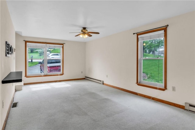 1636 Brodhead Rd, Moon/Crescent Twp, PA 15108 - spare room featuring a baseboard heating unit, carpet flooring, ceiling fan, and plenty of natural light