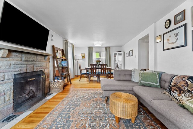 1137 Merrick Ave, Brookline, PA 15226 - living area with wood finished floors and a stone fireplace