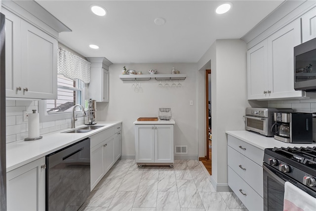 1137 Merrick Ave, Brookline, PA 15226 - kitchen with dishwashing machine, a sink, light countertops, backsplash, and recessed lighting