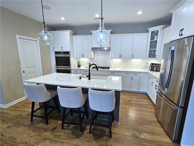 129 Bay Ct, Chartiers, PA 15301 - kitchen featuring appliances with stainless steel finishes, glass insert cabinets, a sink, white cabinets, and recessed lighting
