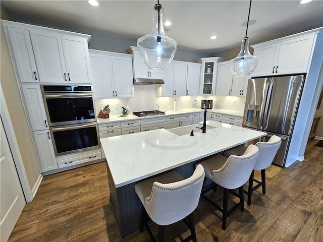 129 Bay Ct, Chartiers, PA 15301 - kitchen featuring appliances with stainless steel finishes, dark wood-style flooring, white cabinetry, recessed lighting, and light countertops