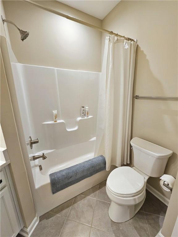 129 Bay Ct, Chartiers, PA 15301 - bathroom with shower / bath combo, toilet, and tile patterned floors
