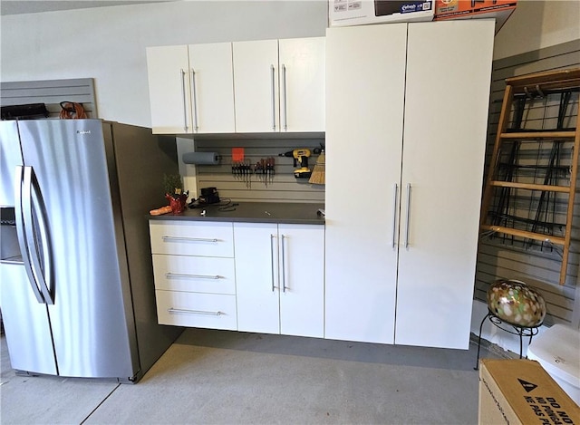 129 Bay Ct, Chartiers, PA 15301 - kitchen featuring stainless steel refrigerator with ice dispenser, white cabinetry, and dark countertops