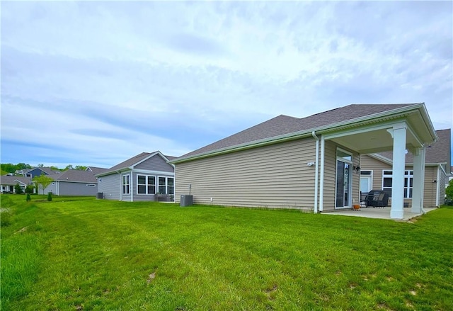 129 Bay Ct, Chartiers, PA 15301 - back of property featuring a patio area, a yard, central AC, and a shingled roof