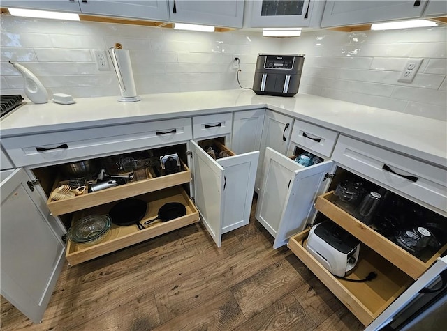 129 Bay Ct, Chartiers, PA 15301 - kitchen with dark wood finished floors, decorative backsplash, and light countertops