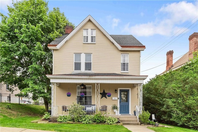 106 Haldane St, Crafton, PA 15205 - view of front of home featuring a porch, a front yard, a chimney, and a shingled roof
