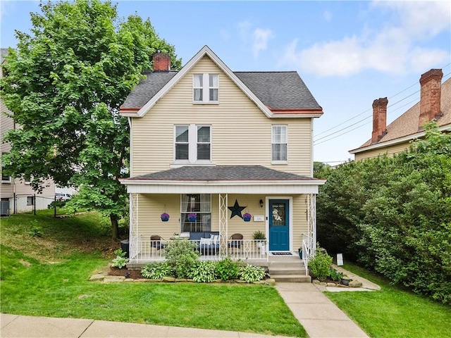 106 Haldane St, Crafton, PA 15205 - view of front facade with covered porch, a front yard, central AC, and a shingled roof