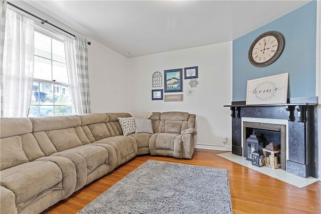 106 Haldane St, Crafton, PA 15205 - living area with wood finished floors and a fireplace with flush hearth