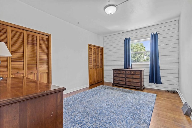 106 Haldane St, Crafton, PA 15205 - bedroom featuring wood finished floors, multiple closets, and baseboards