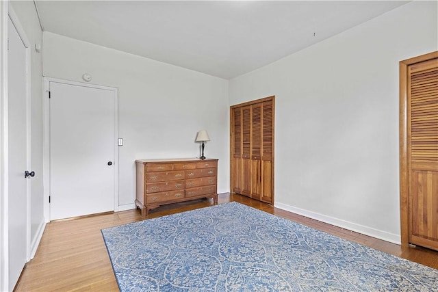 106 Haldane St, Crafton, PA 15205 - bedroom featuring wood finished floors, two closets, and baseboards