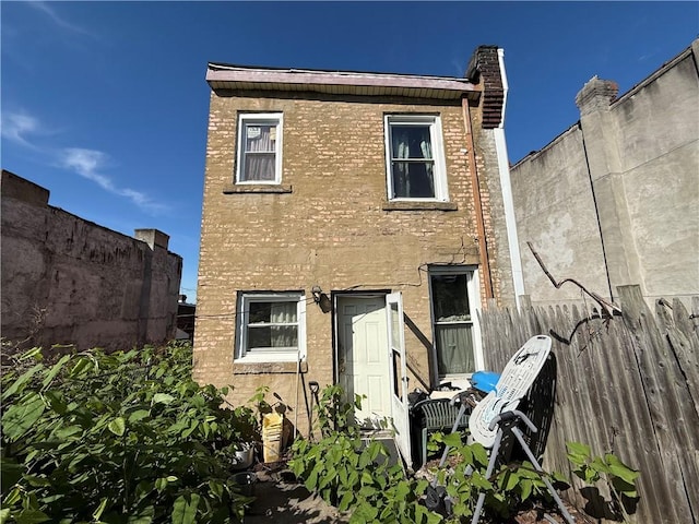 614 Hollace St, Hill District, PA 15219 - rear view of house featuring fence and brick siding