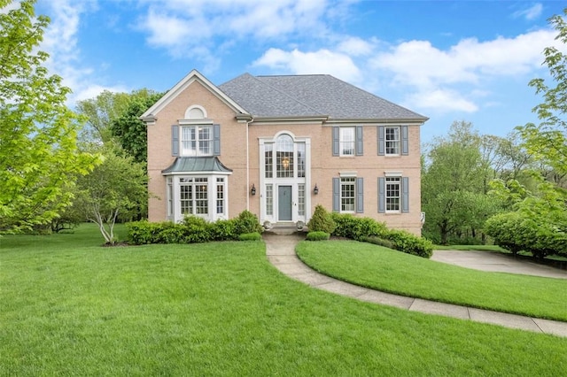colonial home with a front yard
