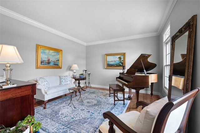 living room featuring crown molding, wood finished floors, and baseboards