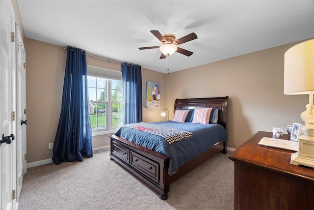 bedroom featuring carpet floors, baseboards, and ceiling fan