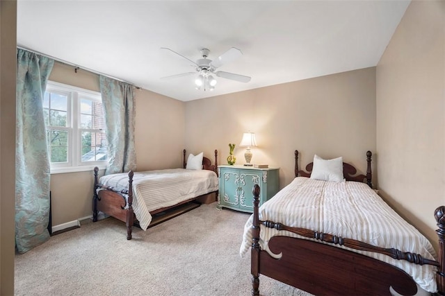 carpeted bedroom featuring ceiling fan and baseboards