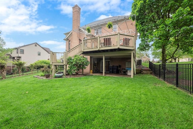 rear view of property featuring a chimney, a deck, and stairs