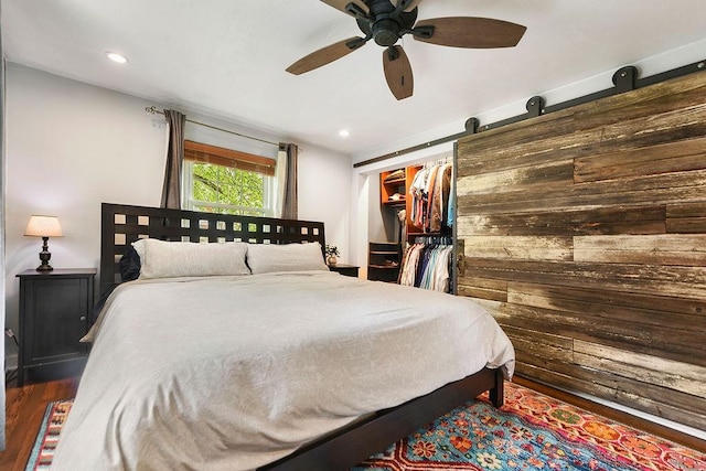 bedroom featuring wood finished floors, recessed lighting, and ceiling fan