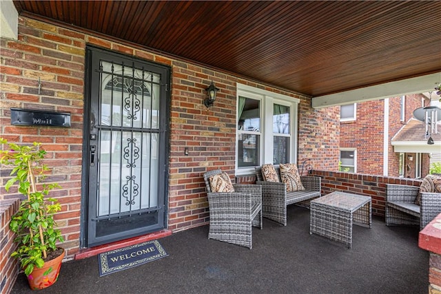 57 Laurel Ave, City Of Washington, PA 15301 - property entrance featuring brick siding, an outdoor hangout area, and a porch