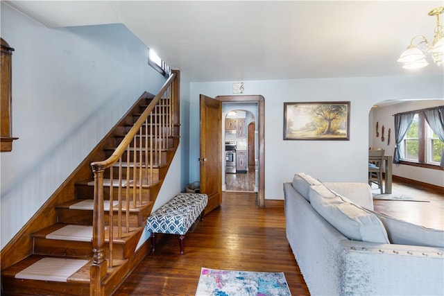 57 Laurel Ave, City Of Washington, PA 15301 - stairs with arched walkways, wood finished floors, and baseboards