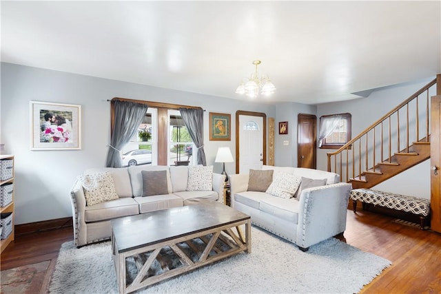 57 Laurel Ave, City Of Washington, PA 15301 - living area featuring healthy amount of natural light, a chandelier, stairway, and wood finished floors