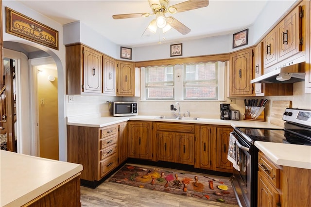 57 Laurel Ave, City Of Washington, PA 15301 - kitchen with stainless steel appliances, a sink, under cabinet range hood, a ceiling fan, and light countertops