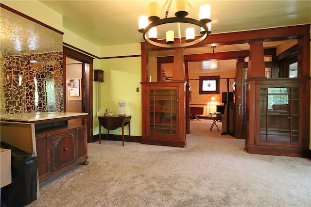 carpeted dining space featuring a chandelier