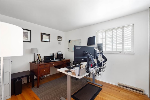 office area with light wood-style floors