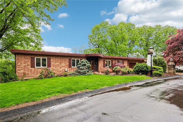 46 Churchill Rd, Churchill Boro, PA 15235 - single story home with brick siding and a front lawn