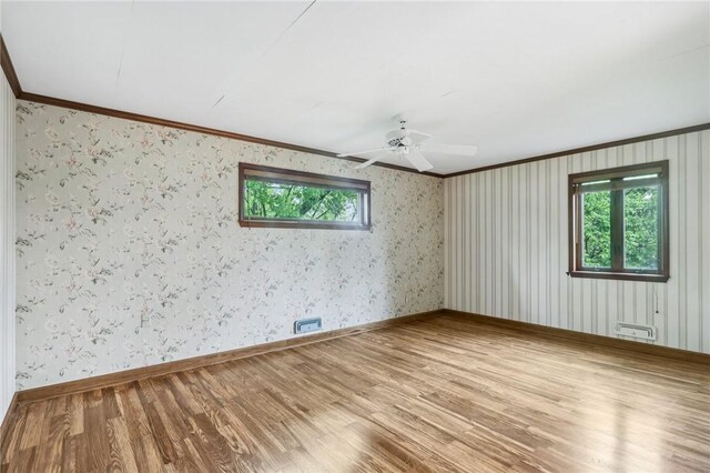 46 Churchill Rd, Churchill Boro, PA 15235 - unfurnished room featuring ornamental molding, wood finished floors, a ceiling fan, baseboards, and wallpapered walls