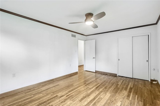 46 Churchill Rd, Churchill Boro, PA 15235 - unfurnished bedroom with ornamental molding, wood finished floors, baseboards, a closet, and ceiling fan