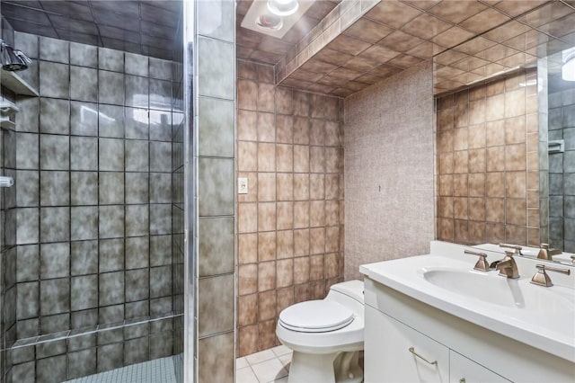 46 Churchill Rd, Churchill Boro, PA 15235 - full bathroom featuring tile walls, a shower stall, toilet, vanity, and tile patterned floors