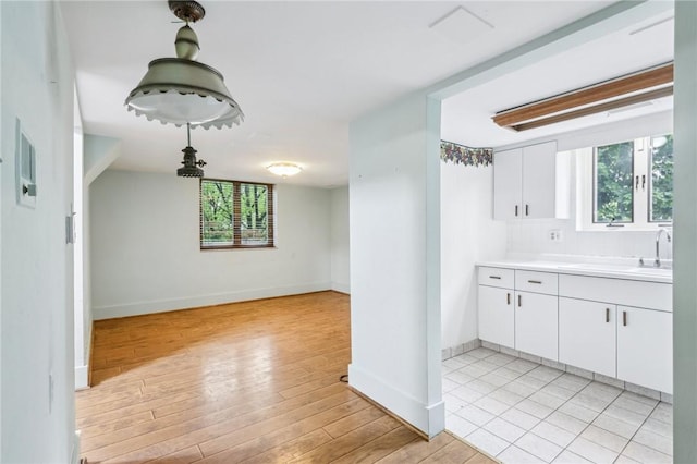 46 Churchill Rd, Churchill Boro, PA 15235 - kitchen with white cabinetry, light countertops, and baseboards