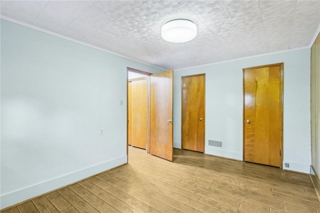 46 Churchill Rd, Churchill Boro, PA 15235 - unfurnished bedroom with ornamental molding, light wood-style floors, and baseboards