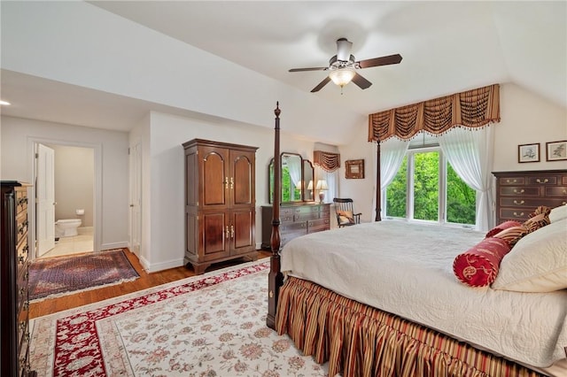 bedroom with vaulted ceiling, light wood finished floors, baseboards, and ceiling fan