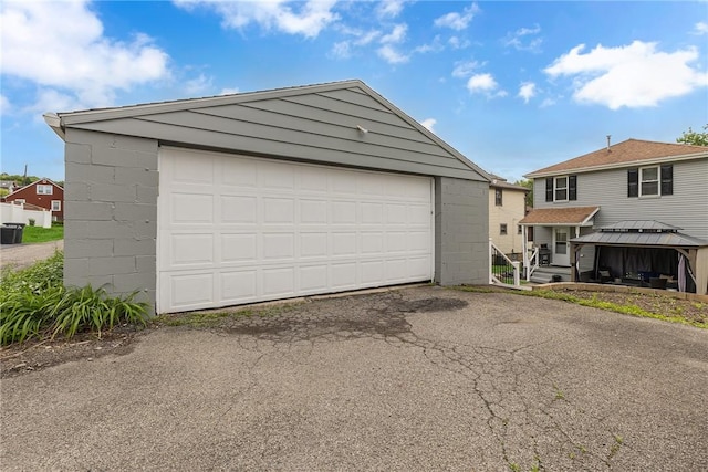 garage featuring driveway