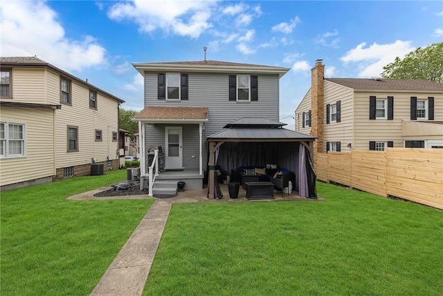 back of house featuring outdoor lounge area, a gazebo, and central AC