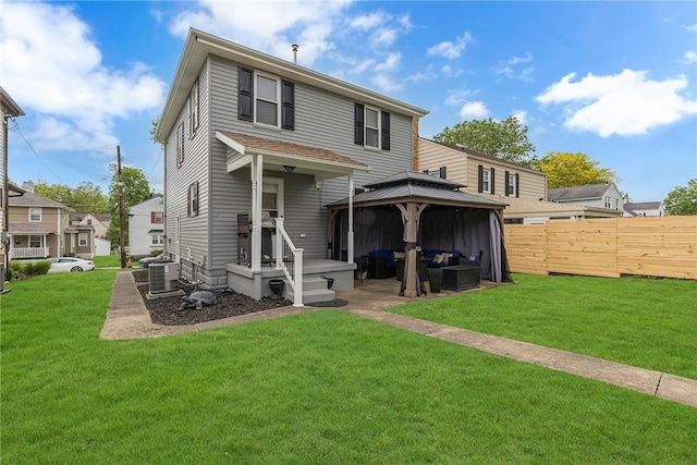 back of house featuring a gazebo, cooling unit, and an outdoor living space