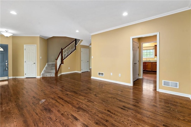 unfurnished living room featuring crown molding, dark wood-style flooring, stairway, baseboards, and recessed lighting