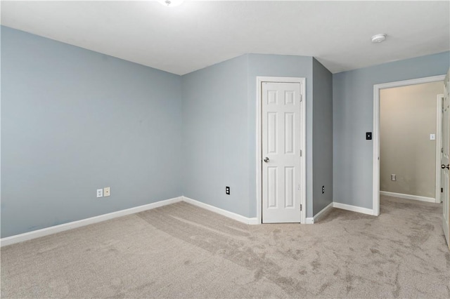 bonus room with carpet and baseboards