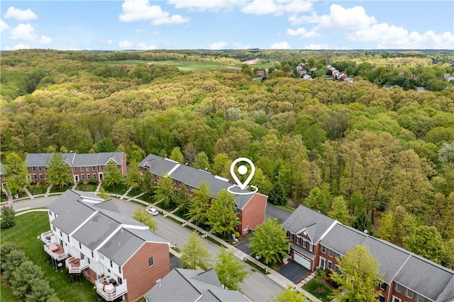 aerial view of residential area with a forest