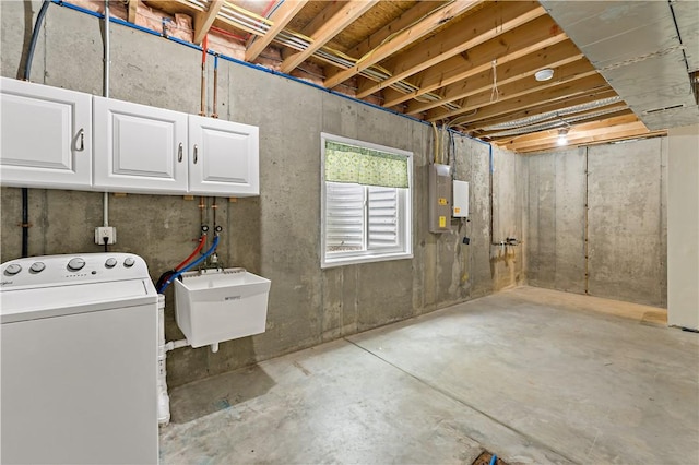 below grade area featuring washer / clothes dryer and a sink